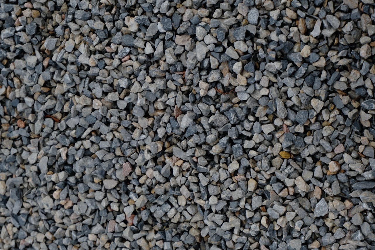 High-resolution image of crushed gravel stones, ideal for construction and landscaping projects.